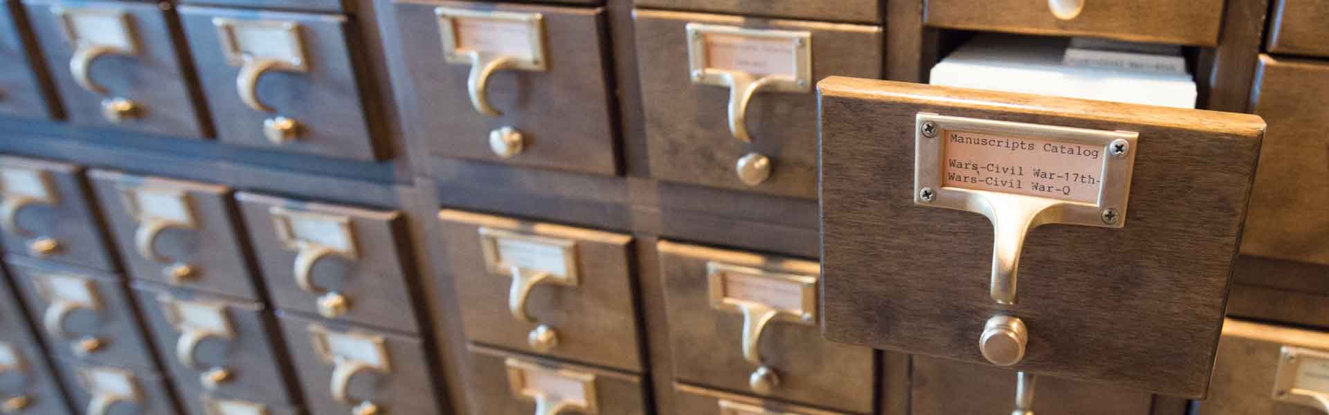 Card catalog with one open drawer