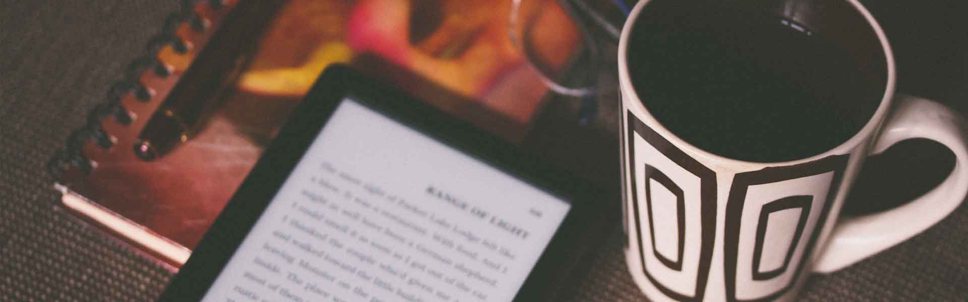 e-reader and mug