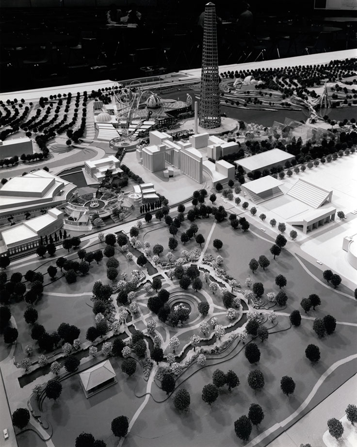 Rendering of Military Park in the foreground, with new landscaping features, including incorporating the canal into the park. Directly south are a series of buildings called the "Performing Arts Quadrangle." To the west of that is a few historic buildings of the Acme-Evans Mill, which were ultimately torn down.